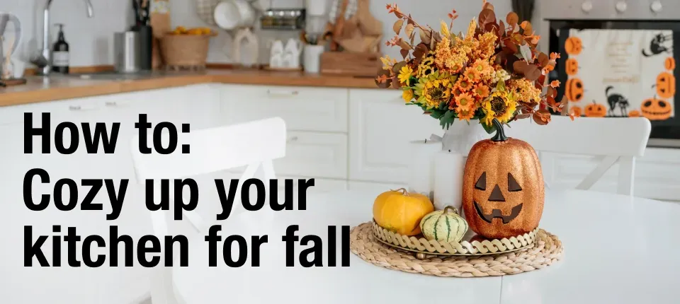 graphic that says 'How to cozy up your kitchen for fall' over a photo of a kitchen with fall and halloween decor